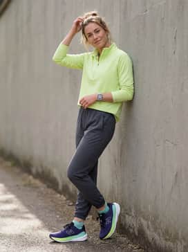 Dark grey joggers with a lime green quarter-zip pullover to coordinate with the neon accents for an evening jog.
