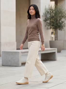 Pair with cream-colored wide-leg trousers and a fitted mocha turtleneck for a sophisticated, tonally-coordinated look.