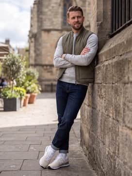 Urban Commuter: Combine with dark-wash tapered denim, a heather grey high-quality crewneck sweatshirt, and a quilted olive green utility vest for a versatile city-ready outfit.