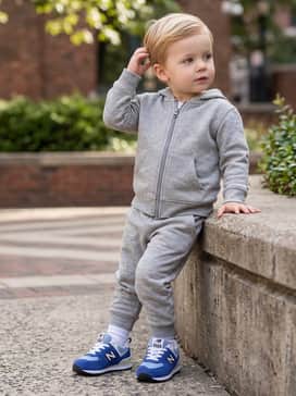 Grey cotton sweatpants paired with a matching navy blue zip-up hoodie for a cozy, coordinated athletic style.
