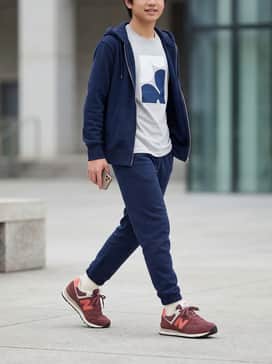 A pair of navy blue joggers paired with a light grey graphic t-shirt and a matching navy zip-up hoodie for a comfortable school-ready outfit.
