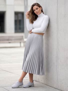 Adidas By Stella Mccartney Taekwondo Shoes – A pleated silver midi skirt and a fitted white cropped turtleneck to emphasize the shoe's sleek, futuristic silhouette.