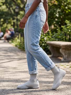 Adidas By Stella Mccartney Taekwondo Shoes – Cuffed straight-leg light wash jeans paired with a minimalist navy blue cashmere sweater for a clean and comfortable weekend outfit.