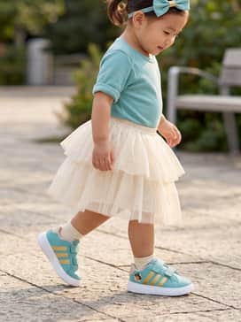Adidas Disney Grand Court 30 Shoes Infants – A soft gold-flecked cream tutu paired with a simple teal onesie and a matching bow headband for a whimsical look.