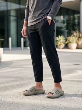 Black moisture-wicking joggers and a fitted charcoal grey compression shirt to emphasize a sleek, athletic recovery aesthetic.