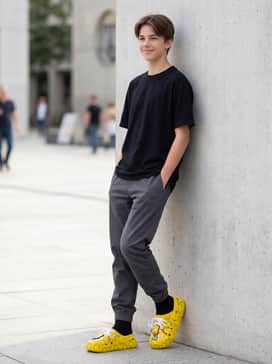 Relaxed-fit straight-leg jeans with a simple white ribbed tank top and an unbuttoned yellow flannel shirt.