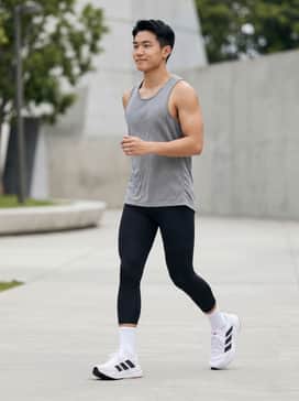 Adistar 4 Running Shoes – Performance-ready: Pair with black moisture-wicking compression shorts, a lightweight grey technical mesh tank top, and white quarter-length socks for a streamlined running silhouette.