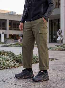 Modern Gorpcore: Combine with wide-leg olive cargo trousers, a black technical fleece gilet over a grey long-sleeve base layer, and a functional crossbody bag for an outdoor-inspired urban vibe.