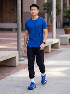 Adizero Adios Pro 4 Shoes – A professional racing kit featuring a cobalt blue moisture-wicking singlet, 2-inch black split shorts, and white aerodynamic compression socks.