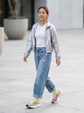 Adizero Aruku Shoes – Wide-leg distressed light-wash denim paired with a cropped silver metallic windbreaker and a simple white ribbed tank top to echo the shoe's futuristic accents.