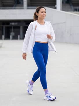 Adizero Boston 12 Shoes – High-waisted cobalt blue compression leggings paired with a white moisture-wicking cropped tank and thin lavender running socks.