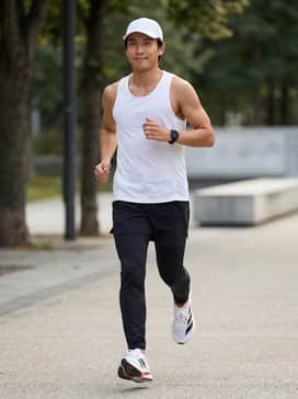 Pair with lightweight, moisture-wicking compression shorts and a neon-accented technical running tank for a high-performance marathon training look.