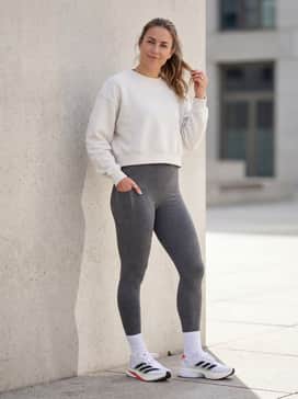 Combine with high-waisted performance leggings and a breathable cropped sweatshirt for a comfortable and stylish gym-to-cafe outfit.