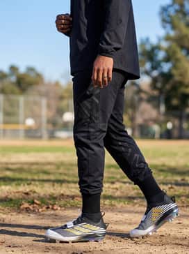 Adizero Edge Cleats – Custom team-branded black windbreaker and performance joggers for a coordinated look during pre-game warm-ups and travel.