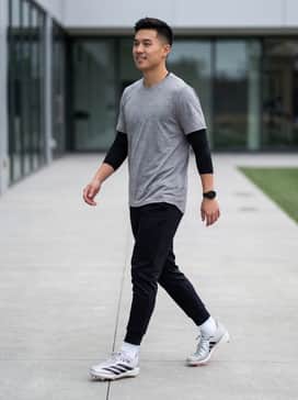 Performance field gear including padded football pants, a moisture-wicking compression jersey, and coordinated athletic socks.