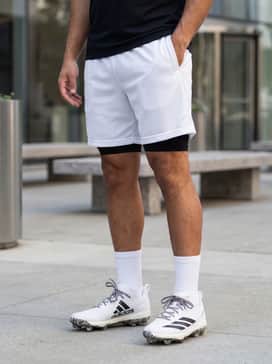 Adizero Electric 20 Exotic Speed Tpu Cleats – A sleek black moisture-wicking technical tank top paired with white mesh athletic shorts to emphasize the monochromatic colorway.