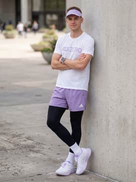 Adizero Evo Sl – High-waisted lilac running shorts combined with an oversized white mesh tee and a light purple visor to lean into the pastel color palette during summer runs.