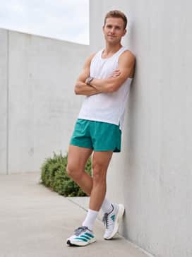 Summer Training: Combine with 5-inch teal running shorts, a breathable white mesh tank, and matching white crew socks for a coordinated and energetic aesthetic.