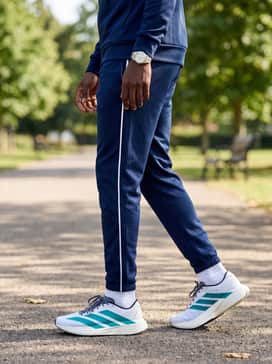 Adizero Evo Sl – Modern Tracksuit: Wear with a slim-fit navy blue track suit featuring white side stripes to complement the bold branding and sleek profile of the sneakers.