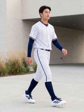 Adizero Impact 20 Baseball Cleats – A professional-grade baseball uniform featuring white pinstriped knickers, a navy blue moisture-wicking undershirt, and a matching team jersey for a classic field look.