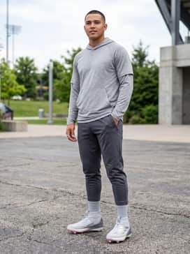 Adizero Impact 20 Cleats – Pre-game warm-up attire consisting of compression leggings, athletic mesh shorts, and a lightweight technical training hoodie.