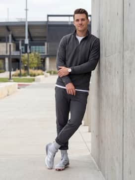 Adizero Impact 20 Cleats – Game day travel look with charcoal grey tech-fleece joggers and a matching quarter-zip performance pullover.