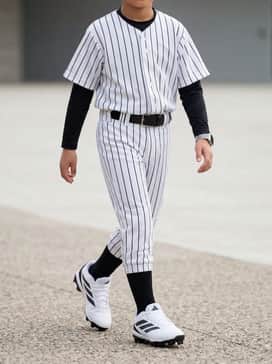 Adizero Impact 20 Molded Cleats Kids – A full team uniform consisting of a button-down baseball jersey, matching pinstriped trousers, and high-performance black socks for a professional game-day look.