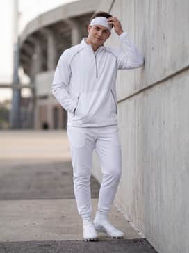 Adizero Impact Ii Football Cleats – A coordinated team warm-up ensemble including white tapered track pants, a silver-accented quarter-zip windbreaker, and a white performance headband.