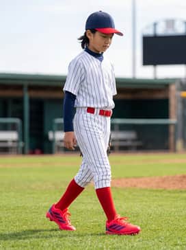 Adizero Impact Molded Rubber Kids 20 Shades Bsb Shoes – A traditional white pinstripe baseball uniform with integrated red stirrup socks, a matching red belt, and a navy blue moisture-wicking undershirt for a classic on-field appearance.