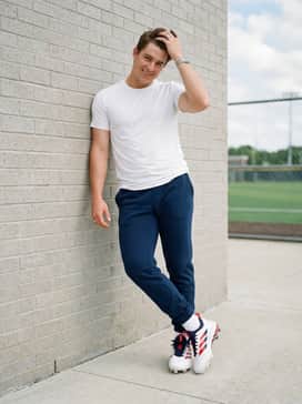 Adizero Impact Tpu 20 Usa Cleats – A classic practice look with navy fleece joggers and a fitted white performance t-shirt for drills and batting practice sessions.