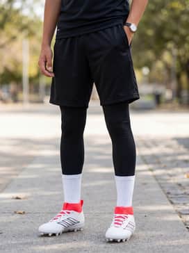 Adizero Impact2 Ii Kids Patrick Mahomes Cleats – Training attire consisting of black compression leggings under breathable mesh shorts, paired with a lightweight technical t-shirt.