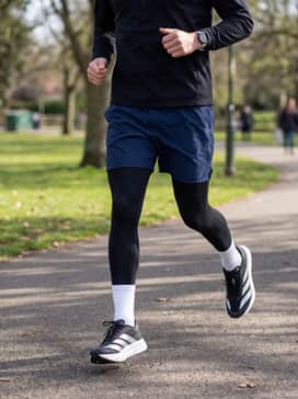 Warm-up Ready: Wear with black compression tights under navy blue athletic shorts and a quarter-zip training pullover for early morning outdoor workouts.
