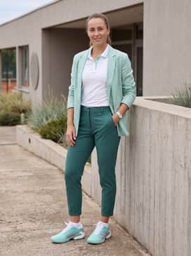 Adizero Ubersonic 5 Tennis Shoes – A fresh, casual weekend ensemble with light-wash distressed denim shorts, a simple white tank top, and an unbuttoned mint-colored linen shirt.