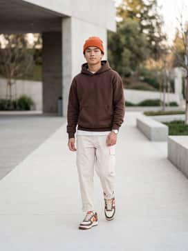 Air Force 1 07 – A pair of relaxed-fit cream cargo pants paired with a heavyweight chocolate brown hoodie and a subtle orange beanie to highlight the shoe's accent color.