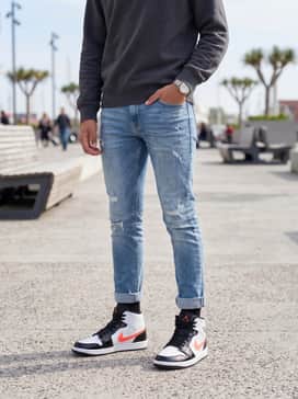 Combine with distressed slim-fit light-wash jeans and a charcoal grey crewneck sweatshirt for a relaxed weekend aesthetic.