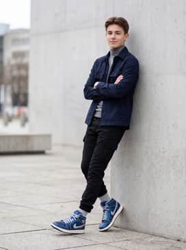 Black utility cargo pants with adjustable cuffs, a tucked-in grey turtleneck, and a structured navy overshirt for a modern street-style silhouette.