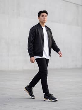 Air Jordan 4 Rm – Pair with slim-fit black denim jeans, a crisp white oversized tee, and a black bomber jacket for a sharp, monochromatic street look.