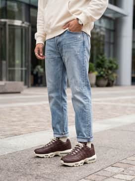 Style with light-wash distressed denim jeans and an oversized cream-colored hoodie to highlight the sneaker's midsole and laces.