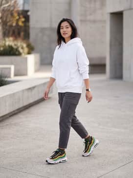 Pair with charcoal grey tapered cargo pants and a crisp white oversized hoodie to let the vibrant yellow and green panels pop.