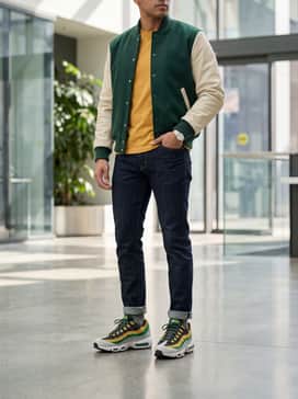Air Max 95 Big Bubble X Norfolk State – Style with dark-wash slim-fit denim and a forest green varsity jacket to harmonize with the collegiate color scheme.