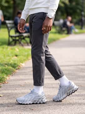 Modern minimalist: Wear with charcoal grey chinos, a high-quality white mock-neck sweater, and a minimalist grey overcoat to let the complex design of the shoe serve as the focal point of a clean outfit.