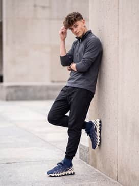 Black nylon joggers and a grey technical quarter-zip pullover to lean into the futuristic techwear aesthetic of the shoe.