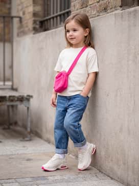 Air Max Fire – A streetwear look featuring baggy mid-wash boyfriend jeans, a white graphic t-shirt, and a pink crossbody bag to echo the vibrant Air unit.