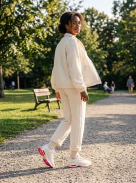 Air Max Fire – An athletic-inspired outfit consisting of cream-colored straight-leg sweatpants and a matching zip-up windbreaker for a cohesive and sporty aesthetic.