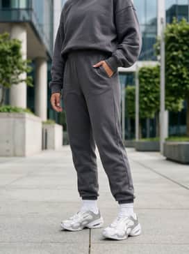 Air Max Muse – High-waisted charcoal grey joggers and a matching oversized hoodie for a sleek, monochromatic loungewear look.