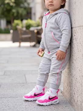 Light grey marl joggers and a matching zip-up hoodie set with pink detailing to complement the shoe's color.