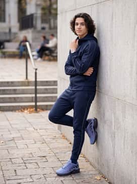 A full navy blue tracksuit with reflective piping to lean into the shoe's athletic heritage and aggressive silhouette.
