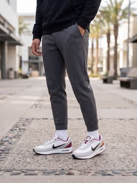 Air Max Verse – Charcoal grey tech-fleece joggers and a black moisture-wicking hoodie for a sleek, monochromatic athleisure aesthetic that lets the shoes pop.