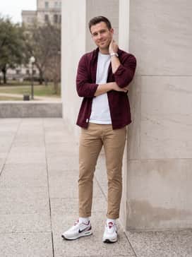 Air Max Verse – Tan slim-fit chinos worn with a crisp white crew-neck t-shirt and a burgundy flannel shirt left unbuttoned for a coordinated casual weekend outfit.