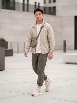 Air Pegasus Wave Premium – A monochromatic gorpcore look with olive green cargo pants, a technical beige windbreaker, and a matching crossbody utility bag to highlight the sneaker's structural details.